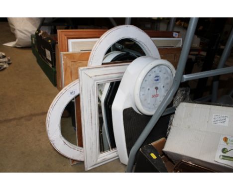 A collection of mirrors and a set of scales