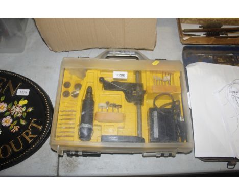 A Stichling mini drill work station in fitted plastic case with stand attachments etc.