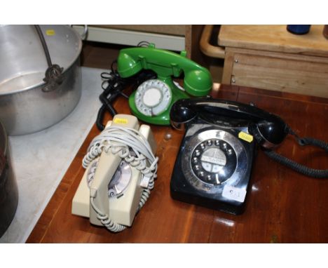 Two rotary dial telephones and one other