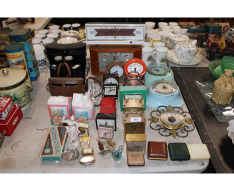 A collection of various clocks, two pairs of binoculars, Liliput lane models, Wade Whimsies etc.