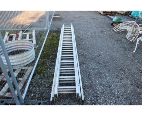 An aluminium double extending ladder 