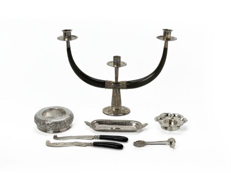 A GROUP OF MALAYSIAN SILVER ITEMS
Kelantan, 20th Century, comprsising: a horn and silver mounted three light candelabra, with