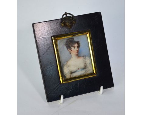 A Regency portrait miniature on ivory of a young lady in white dress with blue ribbon sash, unsigned, 55 x 45 cm, inscribed o