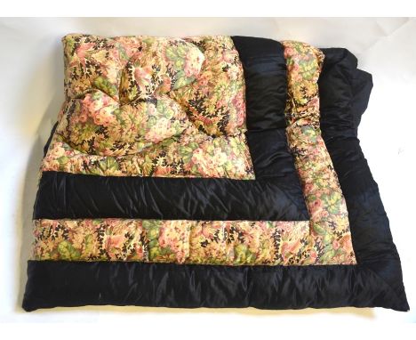 A single black silk eiderdown inset with floral, exotic birds and foliate fabricSome thinning and fraying to inset fabric