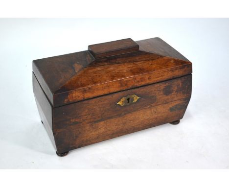 A 19th century sarcophagus form rosewood tea caddy, the interior centred by a hinged top boxes, 36 cm w x 17.5 cm x 20 cm h