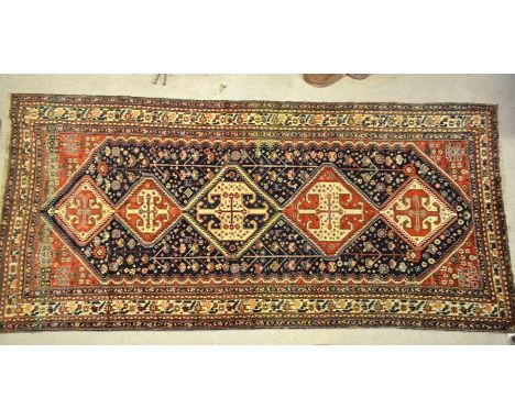 An antique Persian Mahal kellegh carpet, the five rows of lozenges on blue/red ground, 3.65 x 1.68 m&nbsp;Wool good quality, 