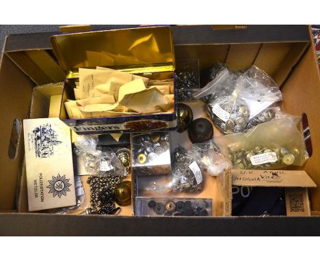 A box of vintage British police force buttons, badges, rank insignia, cloak clasps, police memorabilia etc.