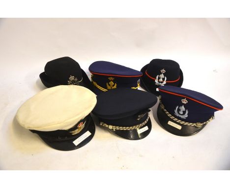 Two boxes of assorted vintage police hats, caps and helmet from Belgium - 13 in total
