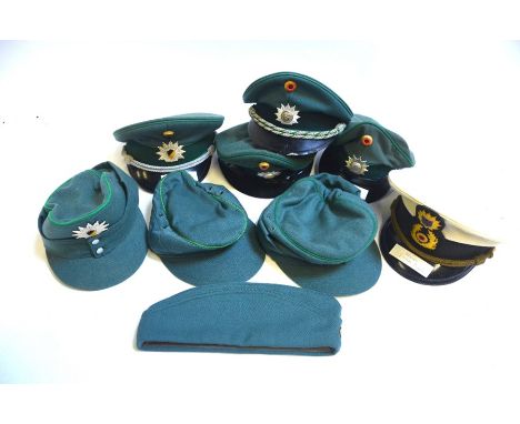 Nine assorted vintage German police hats to include four caps comprising; Hessen Water Police, Schleswig Holstein, Baden Wurt