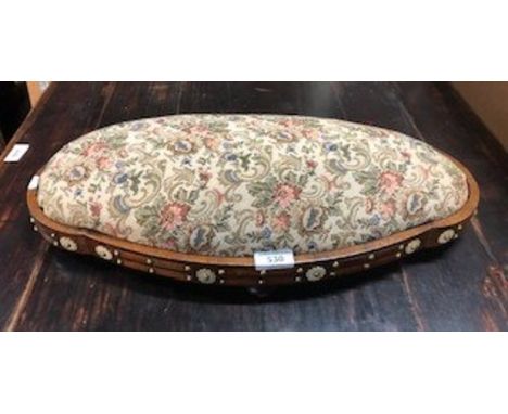 A Victorian brass stud and ivory floral disk-mounted rosewood gout stool, with tapestry style stuffed seat, trade label to un