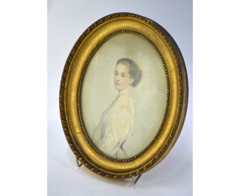 A small 19th century watercolour oval portrait of a young woman in muslin dress, unsigned, 19 x 14 cm , gilt frame