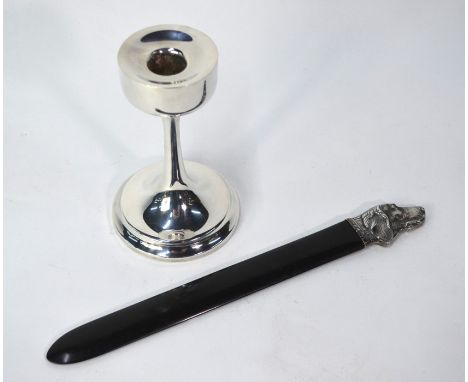 An ebonised page-turner with silver dog's head handle, London 2004, to/w a Danish design electroplated candlestick, maker JHS