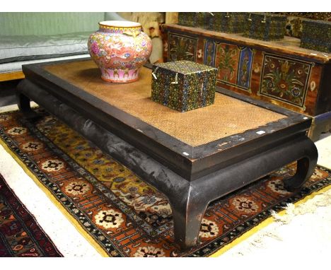 A Chinese rattan panelled lacquered hardwood daybed, raised on four scroll feet, 180 cm x 90 cm x 41 cm h