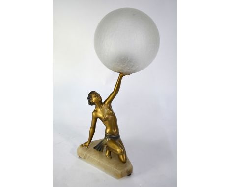 An Art Deco period lamp after Lorenzl, the gilt figure of a kneeling semi-clad young woman holding aloft a textured globe gla