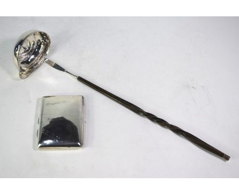 An unmarked white metal punch ladle, inset with a Queen Anne shilling, on twisted whalebone stem, to/w a late Victorian cigar