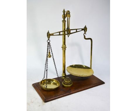 A 19th century brass set of beam scales on teak platform base