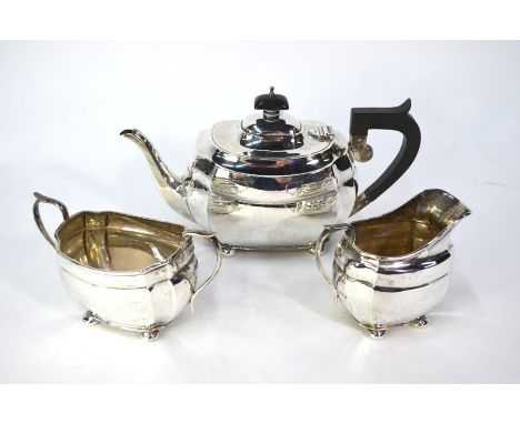 A heavy quality silver three-piece tea service in the Regency manner, with scroll handles and bun feet, S. Blackensee &amp; S