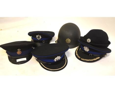 A collection of five assorted vintage Dutch police hats, to/w a Dutch police tin helmet (6)