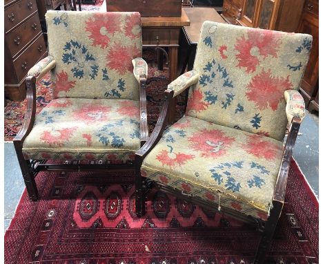 A pair of 19th century Irish Gainsborough library armchairs, the mahogany frames with Chippendale style blind fret-cut detail