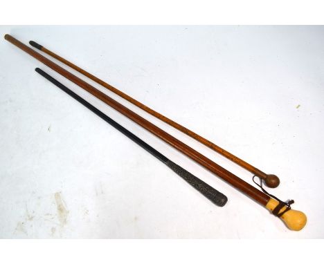 An antique Malacca walking cane with ivory pommel to/w a malacca swagger-stick with copper pommel and a parasol handle with I