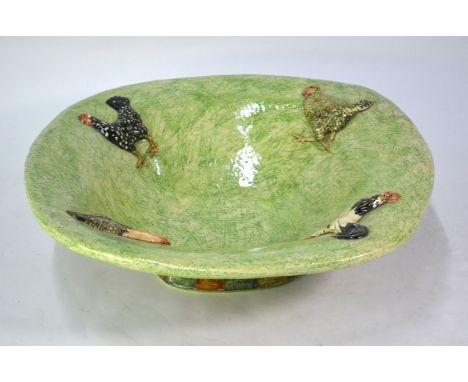 Anna Lambert (b.1957). A large green-glazed ceramic bowl applied with chickens, 44 cm square, signedNo visible defects