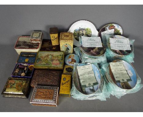 A collection of vintage tins, carved wooden cigarette boxes, Oriental lacquered box and a quantity of collector plates. [2]Lo