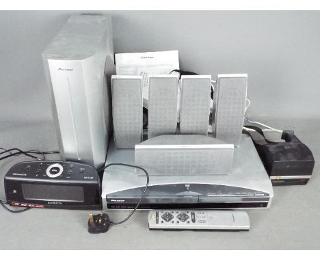 A Pioneer speaker system and DVD receiver, a Roberts radio and Polaroid cameraLot descriptions reflect the cataloguer's opini