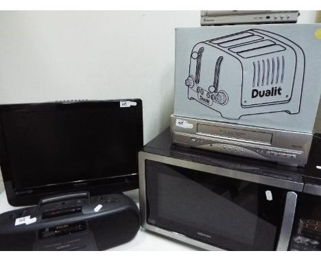 Lot to include a microwave, boxed toaster, video recorder, DVD player and similar. [6]Lot descriptions reflect the cataloguer