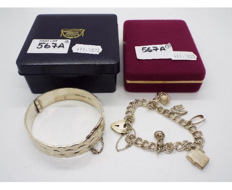 Silver Jewellery - Lot to include a silver, hinged bangle, approximately 6 cm (d) and a silver charm bracelet with silver pad