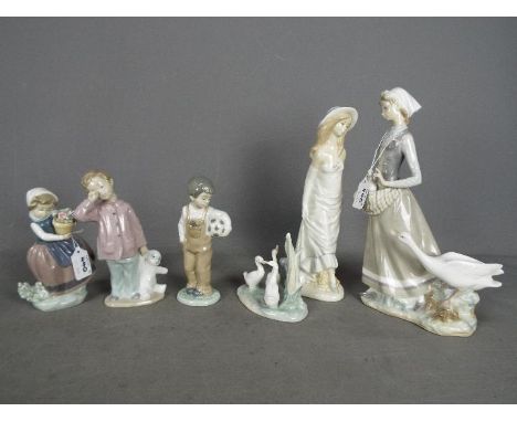 A collection of Spanish porcelain figurines to include Lladro, Nao and similar, largest approximately 31 cm (h). [6]