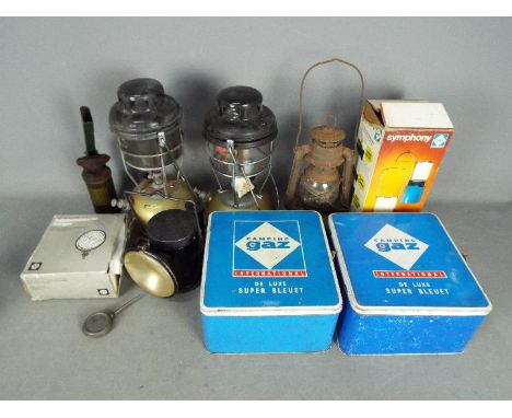 Lot to include vintage camping stoves, oil lamps and an Acme powder blower.Lot descriptions reflect the cataloguer's opinion 
