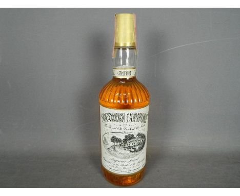 Southern Comfort - A 75cl bottle of Southern Comfort Liquor Spirit, 43% ABV, level low neck, likely a 1980's bottling.