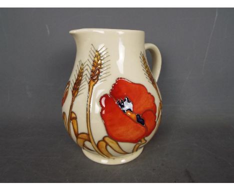 Moorcroft - a Harvest Poppy ceramic jug, approx 15 cm Lot descriptions reflect the cataloguer's opinion only and do not const