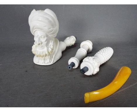 A large, sectional, meerschaum pipe, carved in the form of a bearded gentleman.Lot descriptions reflect the cataloguer's opin
