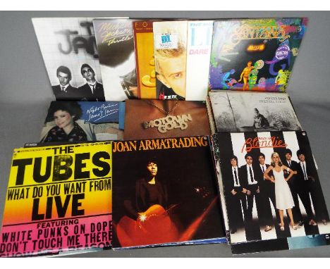 Approximately sixty five 12" vinyl records to include The Jam, Michael Jackson, Billy Idol, The Human League, Crowded House, 