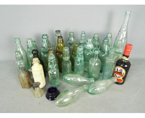 A collection of antique and later glass bottles, a vintage bottle of Christmas Ale and a 'Brew Yourself 35 Pints Of Ginger Be
