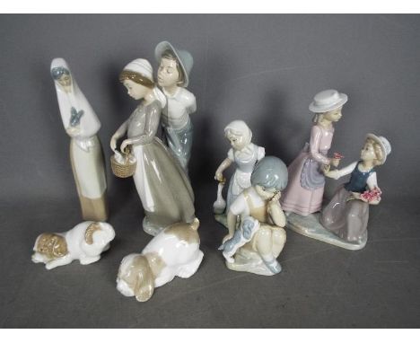 A collection of Spanish Porcelain figurines, predominantly by Nao, largest approximately 29 cm (h).Condition Report: Generall