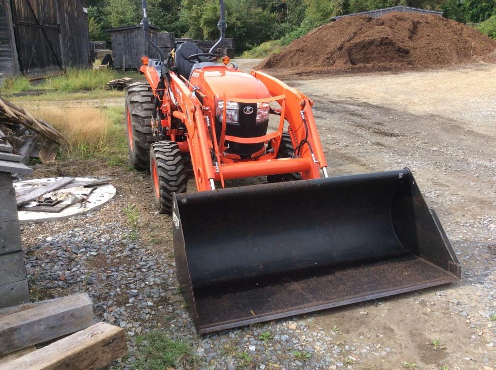 Kubota L5460HST tractor with LA1055 front loader with bucket attachment ...