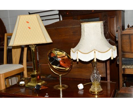 A BRASS COLUMN TABLE LAMP with shade, brassed circular dressing mirror and a modern glass table lamp (3)