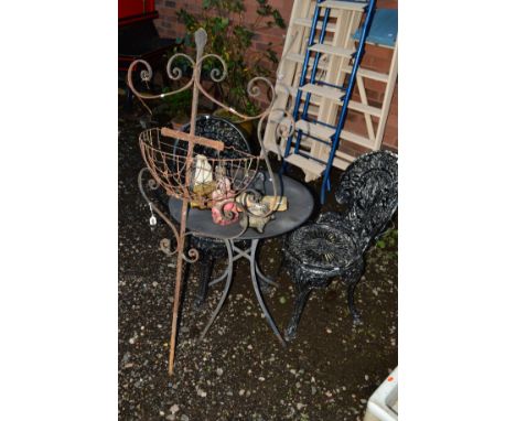 A SMALL ROUND METAL GARDEN TABLE with two black aluminium garden chairs, a wrought iron planter stand and eight small garden 