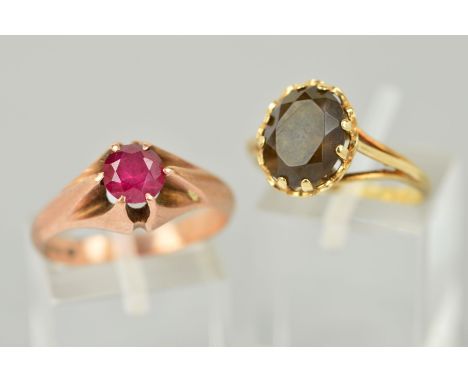 TWO GEM SET RINGS, the first a 9ct gold ring claw set with an oval smokey quartz, hallmarked, ring size M, the second a circu