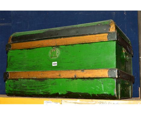A LARGE PAINTED TIN TRUNK