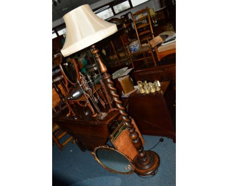 A 20TH CENTURY OAK BARLEY TWIST STANDARD LAMP with a shade