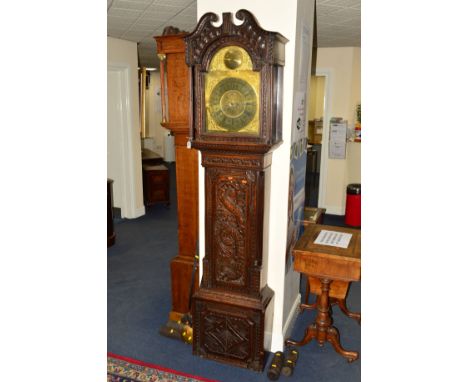 A 18TH CENTURY OAK LONGCASE CLOCK, later carved case, 8 day movement, brass dial diameter 11'', with later spandrels and subs