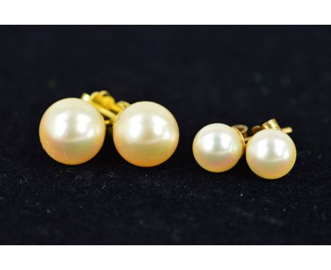 TWO PAIRS OF AKOYA CULTURED PEARL EARRINGS to include a larger pair, pearls measuring approximately 10.3mm in diameter, screw
