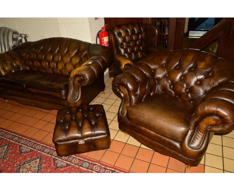 A THOMAS LLOYD BROWN LEATHER FOUR PIECE CHESTERFIELD LOUNGE SUITE, comprising of a two seater settee, width 185cm, winged arm