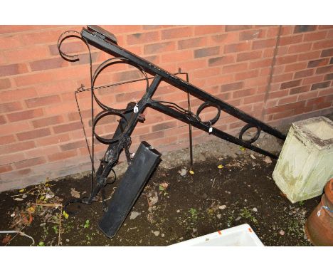 A BLACK PAINTED WROUGHT IRON WALL MOUNTED BRACKET for lighting