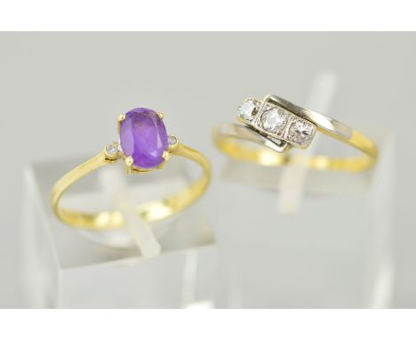 TWO GEM SET RINGS, the first designed as a central oval amethyst flanked by small circular colourless pastes, stamped 585, ri