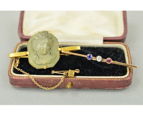 TWO EARLY 20TH CENTURY BROOCHES to include a 9ct gold bar brooch set with a sapphire, diamond and ruby, all within millegrain