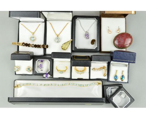 A SELECTION OF GEM JEWELLERY to include topaz pendants, earrings, rings and a bracelet, a matching amethyst pendant, ring and